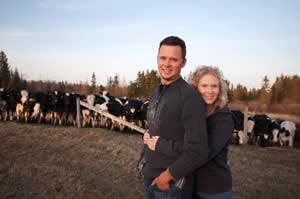 Dairy Farmers Pose on Farm Photo