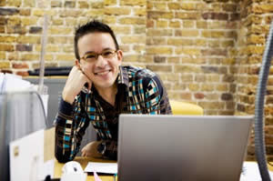 Video Game Designer Working at Desk Photo