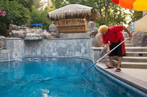 Resort Employee Cleaning Swimming Pool Photo