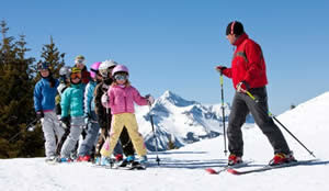 Ski Instructor Teaching Kids to Ski Photo