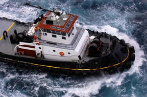 Tugboat Pulling Barge Photo